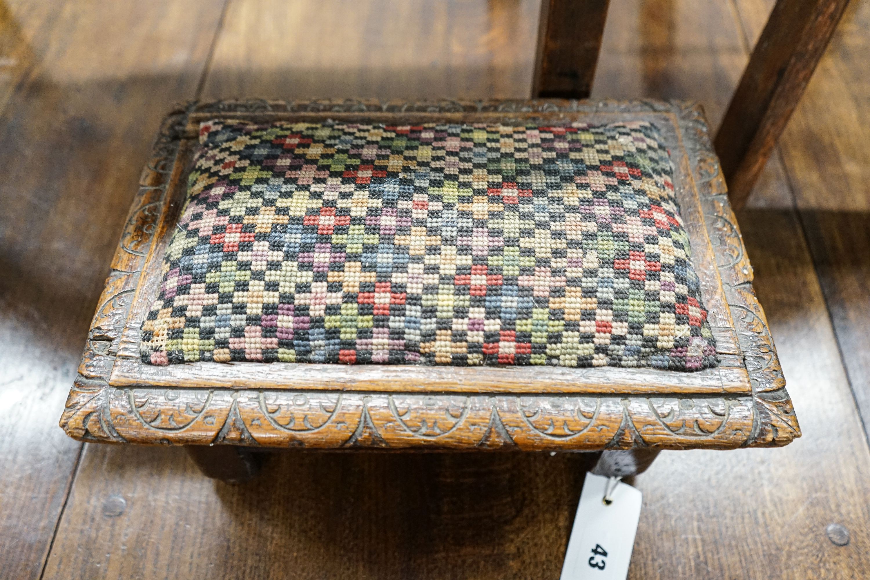 An 18th century oak low table, width 74cm, height 32cm, a carved oak foot stool and an Edwardian oak folding steps stool